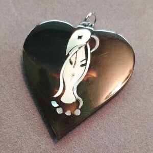 Silver Heart Pendant with Artistic Design